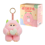 Pink plush keychain with a heart and packaging on a white background