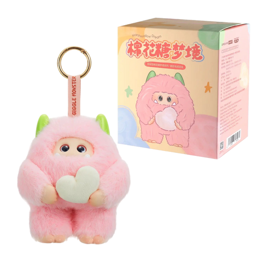Pink plush keychain with a heart and packaging on a white background