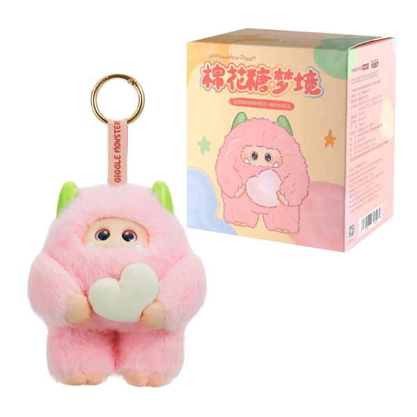 Pink plush keychain with a heart and packaging on a white background